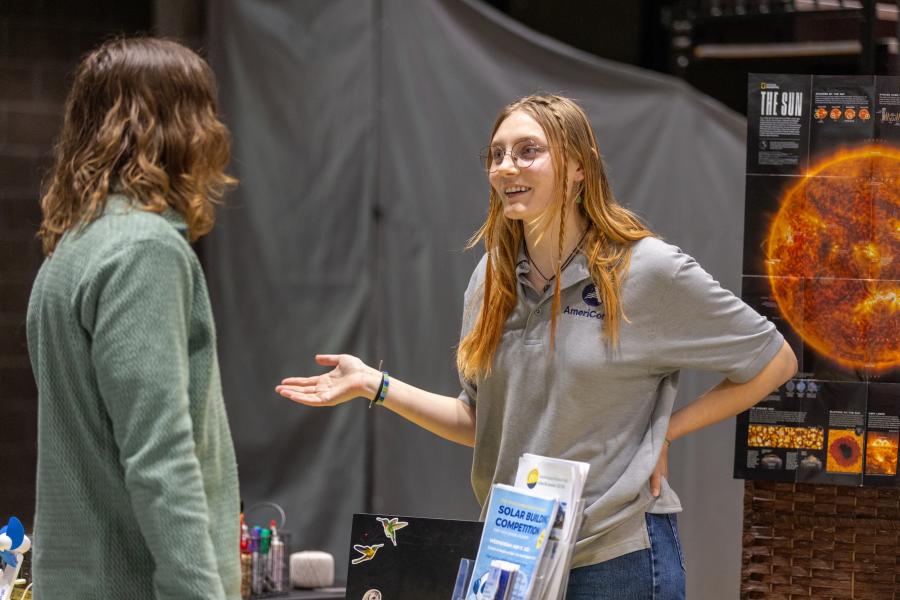 Young women talking at a convention