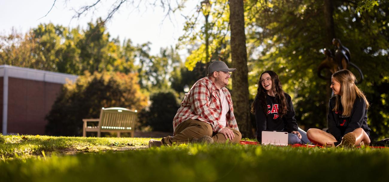 Students sitting on blanket