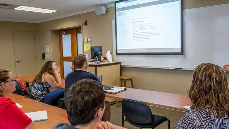 Professor in front of students in classroom