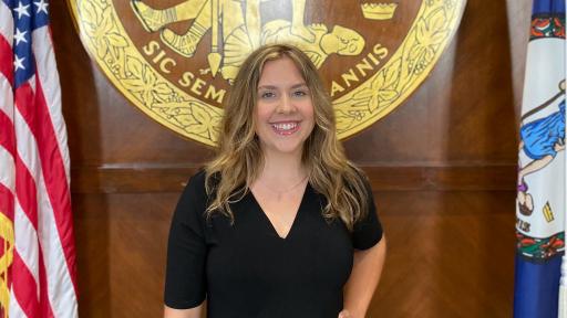 Julianna Jenkins poses at a Commonwealth building as she starts her Fellowship.