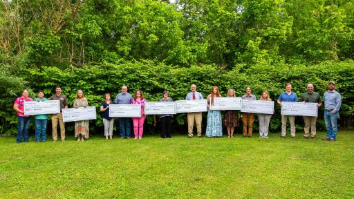 2024 award recipients of the Cumberland Forest Community Fund with their checks