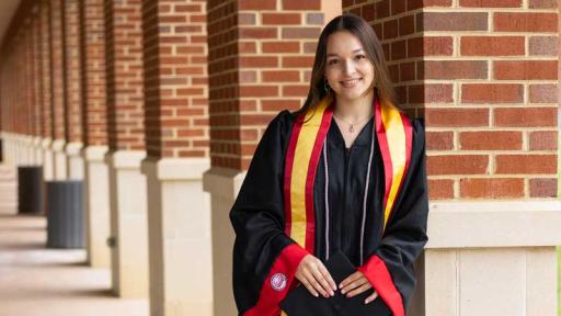 Girl smiling in graduation gown